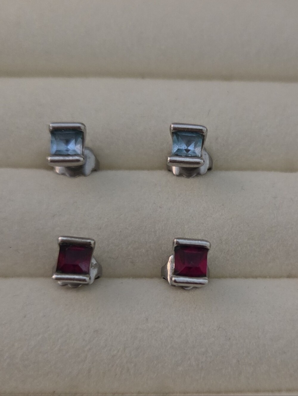 Two Pairs Of Gemstone Earrings Set In Silver Posts Garnet & Blue Topaz